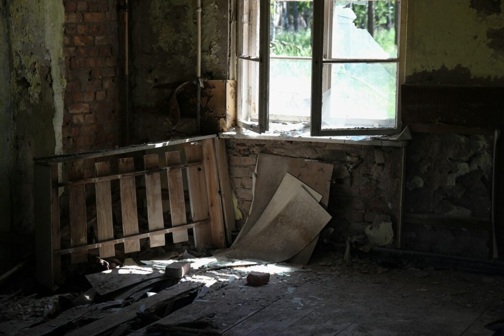 brown wooden board inside abandoned house